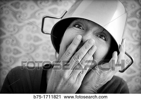 Retrato de mujer de pelo moreno y ojos verdes con una olla en la cabeza, Portrait of brown-haired woman with green eyes and a pot on his head, View Large Photo Image Stock Image - Retrato de mujer de pelo moreno y ojos verdes con una olla en la cabeza, Portrait of brown-haired woman with green eyes and a pot on his head,. Fotosearch