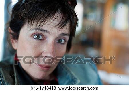 Retrato de mujer de pelo moreno y ojos verdes con expresion relajada, Portrait of brown-haired woman with green eyes and relaxed expression, View Large Photo Image Stock Photo - Retrato de mujer de pelo moreno y ojos verdes con expresion relajada, Portrait of brown-haired woman with green eyes and relaxed expression,. Fotosearch
