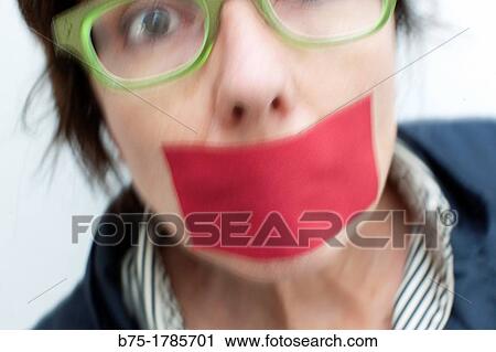 retrato de mujer maltratada con boca tapada con esparadrapo rojo, portrait of abused woman with mouth covered with red bandage, View Large Photo Image Stock Image - retrato de mujer maltratada con boca tapada con esparadrapo rojo, portrait of abused woman with mouth covered with red bandage,. Fotosearch