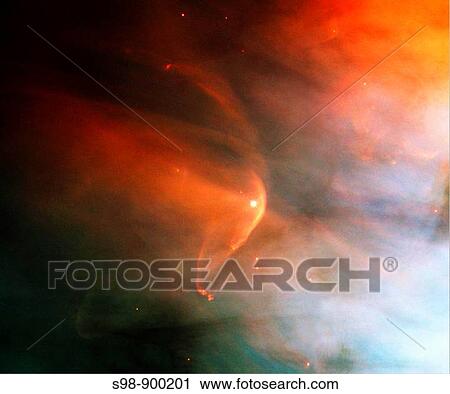 Stock Image - Revealing the stunning and intricate treasures that reside within the nearby, intense star-forming region known as the Great Nebula in Orion, the Hubble Space Telescope focused on one such jewel-a bow shock around the very young star, LL Ori. Fotosearch