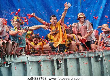 Revellers throw tomatoes from a truck during the annual festival of La Tomatina Bunol, Valencia, Spain View Large Photo Image Stock Photo - Revellers throw tomatoes from a truck during the annual festival of La Tomatina Bunol, Valencia, Spain. Fotosearch