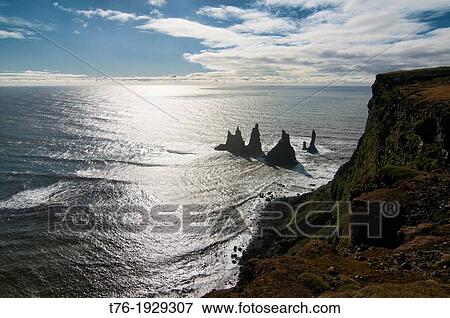 Reynisdrangar sea stack column in Vik, southern Iceland View Large Photo Image Stock Photo - Reynisdrangar sea stack column in Vik, southern Iceland. Fotosearch