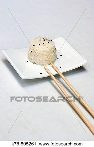 Stock Image - Rice and sticks at Highline restaurant, Meatpacking district, Manhattan, NY, USA. Fotosearch
