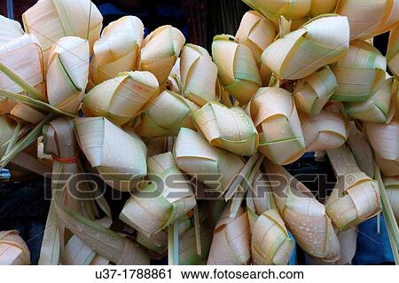 Rice dumpling called? Ketupat? in Malay's words for sale. Image taken taken in front of Kuching State mosque, Sarawak, Malaysia. View Large Photo Image Stock Image - Rice dumpling called? Ketupat? in Malay's words for sale. Image taken taken in front of Kuching State mosque, Sarawak, Malaysia.. Fotosearch