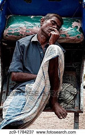Rickshaw wallah sleeping on his rickshaw Calcutta, India View Large Photo Image Stock Photo - Rickshaw wallah sleeping on his rickshaw Calcutta, India. Fotosearch