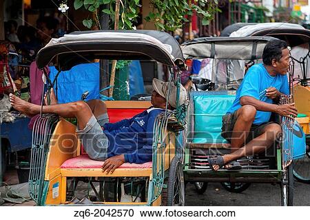 Rickshaws in Yogyakarta in Indonesia View Large Photo Image Stock Image - Rickshaws in Yogyakarta in Indonesia. Fotosearch