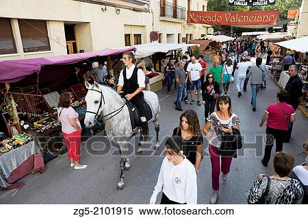 Stock Photography - rider on Andalusian horse in the streets in the annual All Saints Market in Concentaina, Alicante province, Spain.. Fotosearch
