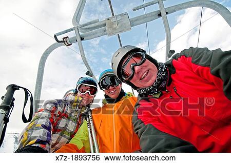 Riding the ski lift while skiing on Bald Mountain at Sun Valley Ski Resort in the city of Ketchum in central Idaho View Large Photo Image Stock Photograph - Riding the ski lift while skiing on Bald Mountain at Sun Valley Ski Resort in the city of Ketchum in central Idaho. Fotosearch