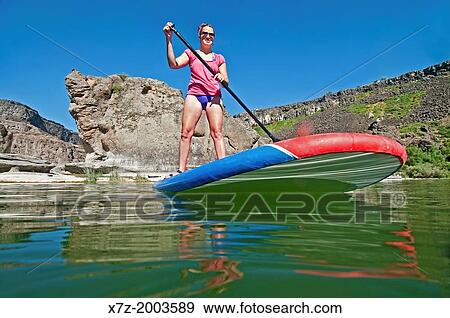riding the Stand Up Paddle Board at Pillar Falls on the Snake River in the Snake River Canyon near the city of Twin Falls in southern Idaho. View Large Photo Image Stock Photo - riding the Stand Up Paddle Board at Pillar Falls on the Snake River in the Snake River Canyon near the city of Twin Falls in southern Idaho.. Fotosearch