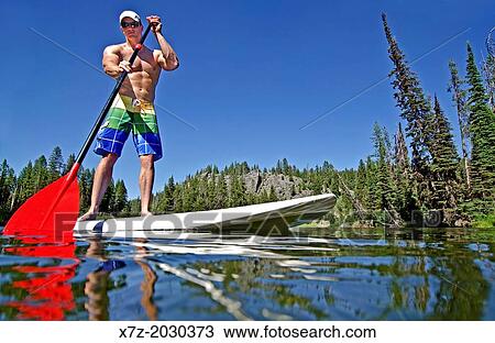 riding the Stand Up Paddle Board on the North Fork of the Payette River near Payette Lake and the city of McCall in the Salmon River Mountains of central Idaho. View Large Photo Image Stock Image - riding the Stand Up Paddle Board on the North Fork of the Payette River near Payette Lake and the city of McCall in the Salmon River Mountains of central Idaho.. Fotosearch