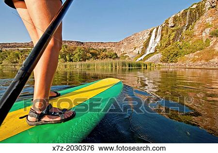 riding the Standup Paddle Board at Thousand Springs in the Snake River Canyon near the city of Hagerman in southern Idaho. View Large Photo Image Stock Photograph - riding the Standup Paddle Board at Thousand Springs in the Snake River Canyon near the city of Hagerman in southern Idaho.. Fotosearch