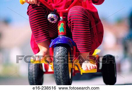 riding tricycle View Large Photo Image Stock Photograph - riding tricycle. Fotosearch