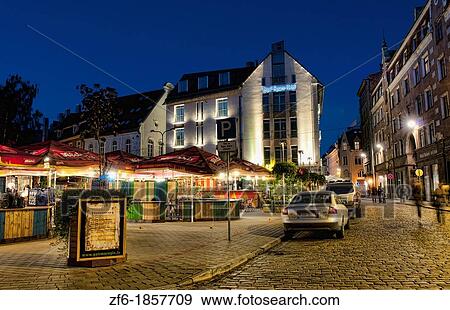 Stock Photo - Riga Latvia modern capital night exposure of buildings in Townhall Square improved Eastern Europe. Fotosearch