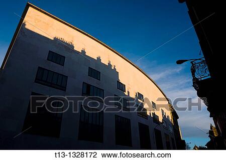 Rijeka in Croatia, theatre? HKD Susak? curved-roof building in a sunset time View Large Photo Image Stock Image - Rijeka in Croatia, theatre? HKD Susak? curved-roof building in a sunset time. Fotosearch
