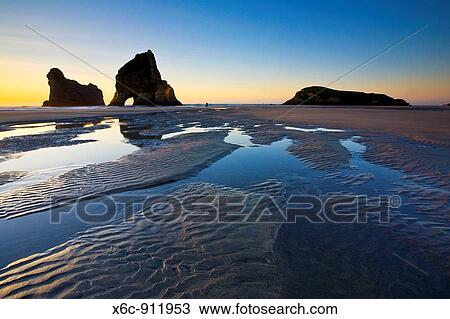 Rippled Sand and rock formations at Wharariki Beach, Nelson, North Island, New Zealand View Large Photo Image Stock Image - Rippled Sand and rock formations at Wharariki Beach, Nelson, North Island, New Zealand. Fotosearch