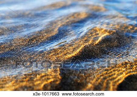 Ripples on calm shallow sea water surface View Large Photo Image Stock Image - Ripples on calm shallow sea water surface. Fotosearch