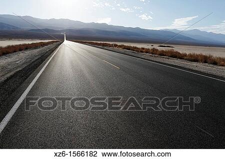 Road across desert, Death Valley National Park, California, USA View Large Photo Image Stock Image - Road across desert, Death Valley National Park, California, USA. Fotosearch