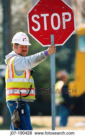 Stock Photo - Road construction traffic worker. Texas. USA. Fotosearch
