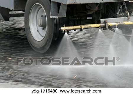 road sweeping truck cleaning dirty street View Large Photo Image Stock Image - road sweeping truck cleaning dirty street. Fotosearch