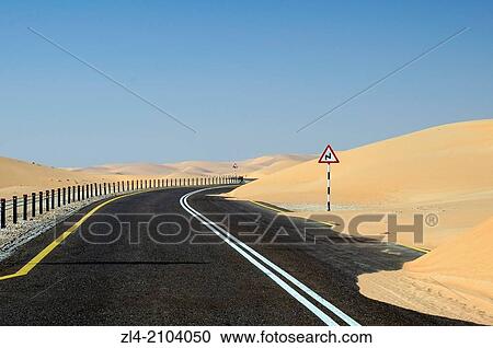 Road through the sand dunes of the empty quarter desert. United Arab Emirates, UAE, Abu Dhabi, Liwa Oasis, Moreeb Hill, Tal Mireb. View Large Photo Image Stock Image - Road through the sand dunes of the empty quarter desert. United Arab Emirates, UAE, Abu Dhabi, Liwa Oasis, Moreeb Hill, Tal Mireb.. Fotosearch