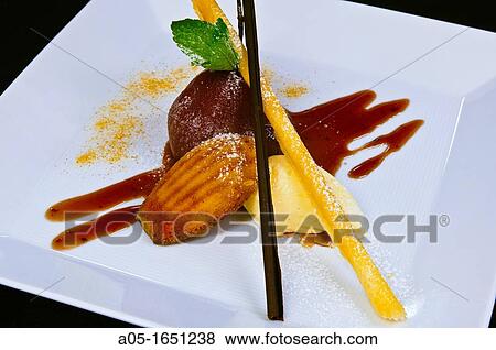 Roast Pear in Banyul with honey ice cream and orange Madeleine The Ritz Restaurant Hotel Ritz London England United Kingdom UK Europe. View Large Photo Image Stock Photo - Roast Pear in Banyul with honey ice cream and orange Madeleine The Ritz Restaurant Hotel Ritz London England United Kingdom UK Europe.. Fotosearch