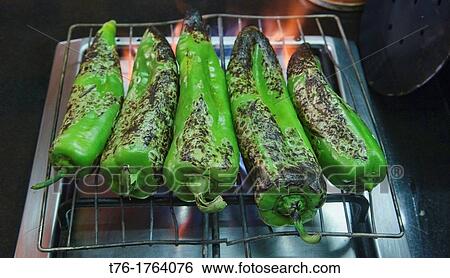 roasting green peppers for a Moroccan tajine in Marrakech, Morocco View Large Photo Image Stock Photograph - roasting green peppers for a Moroccan tajine in Marrakech, Morocco. Fotosearch