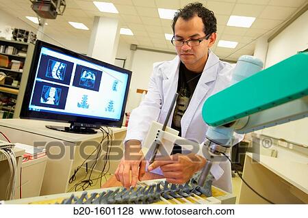 Stock Photo - Robotic system to assist surgery. Fotosearch