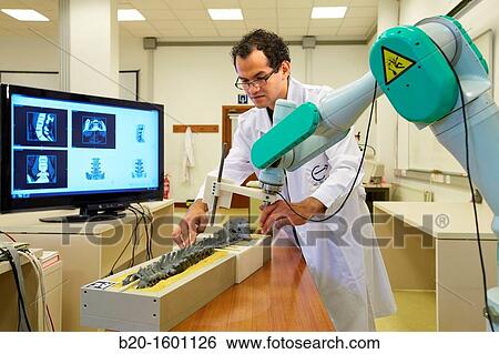 Stock Photograph - Robotic system to assist surgery. Fotosearch