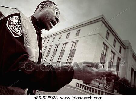 Stock Photo - Rochester, NY street cop. USA. Fotosearch