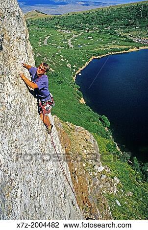 Stock Image - rock climbing a route called Archangel which is rated 5, 10 and located on The Angel Lake Crag at Angel Lake high in the East Humboldt Mountains in northern Nevada.. Fotosearch
