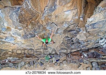 Rock climbing a route called Bolts N Burger which is rated 5, 8 and located at the Black Cliffs in the Boise River Canyon near the city of Boise in southern Idaho. View Large Photo Image Picture - Rock climbing a route called Bolts N Burger which is rated 5, 8 and located at the Black Cliffs in the Boise River Canyon near the city of Boise in southern Idaho.. Fotosearch