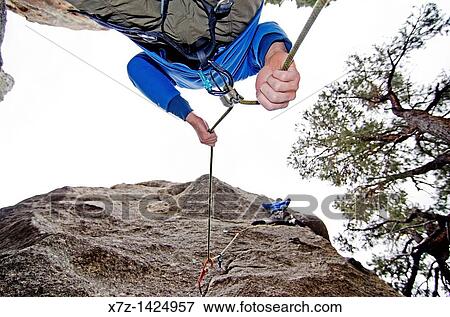 Rock climbing a route called Broke Back which is rated 5, 11 and located on the True Grit formation at Castle Rocks State Park near the town of Almo in southern Idaho View Large Photo Image Stock Photo - Rock climbing a route called Broke Back which is rated 5, 11 and located on the True Grit formation at Castle Rocks State Park near the town of Almo in southern Idaho. Fotosearch