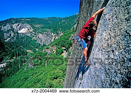 rock climbing a route called Reeds Pinnacle Direct which is rated 5, 10 and located on Reeds Pinnacle in Yosemite Valley at Yosemite National Park in California. View Large Photo Image Stock Photo - rock climbing a route called Reeds Pinnacle Direct which is rated 5, 10 and located on Reeds Pinnacle in Yosemite Valley at Yosemite National Park in California.. Fotosearch