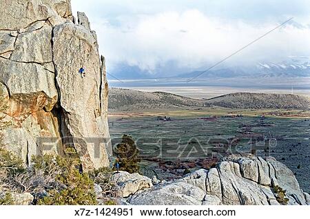 Stock Image - Rock climbing a route called Sancho Rama which is rated 5, 10 and located on the Upper Comp Wall at Castle Rocks State Park near the town of Almo in southern Idaho. Fotosearch