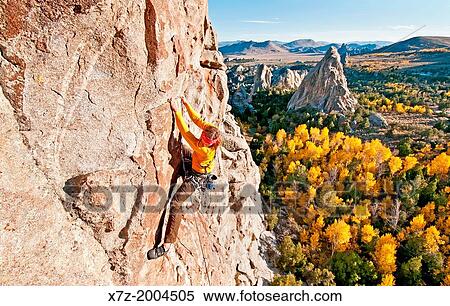 rock climbing a route called Shes The Bosch which is rated 5, 11 and located on Window Rock at The City Of Rocks National Reserve near the town of Almo in southern Idaho. View Large Photo Image Stock Photography - rock climbing a route called Shes The Bosch which is rated 5, 11 and located on Window Rock at The City Of Rocks National Reserve near the town of Almo in southern Idaho.. Fotosearch
