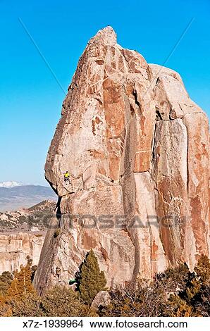 Rock climbing a route called Skyline which is rated 5, 8 and located on Morning Glory Spire at the City Of Rocks National Reserve near the town of Almo in southern Idaho. View Large Photo Image Picture - Rock climbing a route called Skyline which is rated 5, 8 and located on Morning Glory Spire at the City Of Rocks National Reserve near the town of Almo in southern Idaho.. Fotosearch