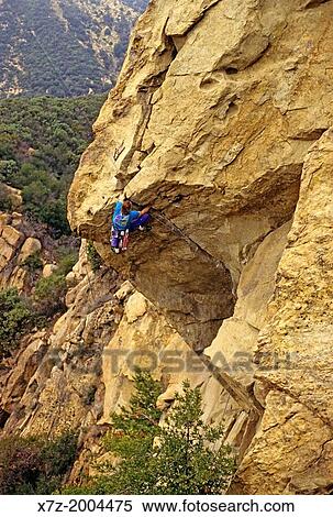 Stock Photography - rock climbing a route called The Nose which is rated 5, 11 and located on Gibraltar Rock in the Santa Ynez Mountains above the city of Santa Barbara in southern California.. Fotosearch