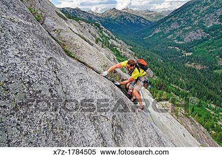 rock climbing a route called the Regular Route which is rated 5, 6 and located on Slick Rock near the city of McCall in the Salmon River Mountains of central Idaho View Large Photo Image Stock Photography - rock climbing a route called the Regular Route which is rated 5, 6 and located on Slick Rock near the city of McCall in the Salmon River Mountains of central Idaho. Fotosearch