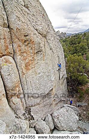 Rock climbing a route called Western Family Values which is rated 5, 10 and located on the True Grit formation at Castle Rocks State Park near the town of Almo in southern Idaho View Large Photo Image Stock Photography - Rock climbing a route called Western Family Values which is rated 5, 10 and located on the True Grit formation at Castle Rocks State Park near the town of Almo in southern Idaho. Fotosearch