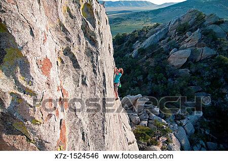 Stock Photograph - Rock climbing a route named Fly Like An Eagle which is rated 5, 11 and located on Eagle Rock at The City Of Rocks National Reserve in southern Idaho. Fotosearch
