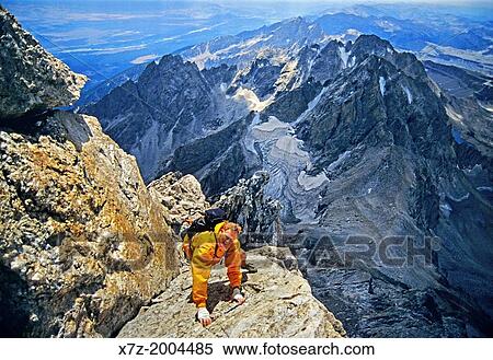 rock climbing free solo the V-Pitch on the Upper Exum Ridge which is rated 5, 4 and located on The Grand Teton at Grand Teton National Park in Wyoming. View Large Photo Image Stock Photography - rock climbing free solo the V-Pitch on the Upper Exum Ridge which is rated 5, 4 and located on The Grand Teton at Grand Teton National Park in Wyoming.. Fotosearch