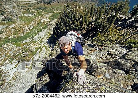 rock climbing the East Ridge route which is rated 5, 4 and located on Cube Point high above Jenny Lake in Grand Teton National Park in northern Wyoming. View Large Photo Image Stock Image - rock climbing the East Ridge route which is rated 5, 4 and located on Cube Point high above Jenny Lake in Grand Teton National Park in northern Wyoming.. Fotosearch