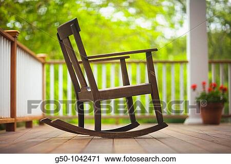 Rocking chair on porch View Large Photo Image Stock Image - Rocking chair on porch. Fotosearch