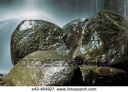 Rocks being spashed by cascading waterfalls, USA View Large Photo Image Stock Photo - Rocks being spashed by cascading waterfalls, USA. Fotosearch