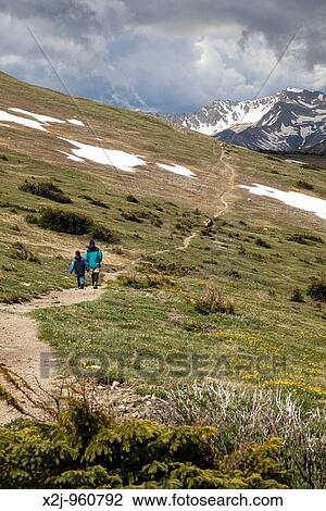 Rocky Mountain National Park, Colorado - John West and his son, Joe, 10, hike on the Ute Trail, on the alpine tundra above tree line MR View Large Photo Image Stock Image - Rocky Mountain National Park, Colorado - John West and his son, Joe, 10, hike on the Ute Trail, on the alpine tundra above tree line MR. Fotosearch