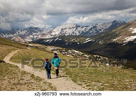 Stock Image - Rocky Mountain National Park, Colorado - John West and his son, Joe, 10, hike on the Ute Trail, on the alpine tundra above tree line MR. Fotosearch