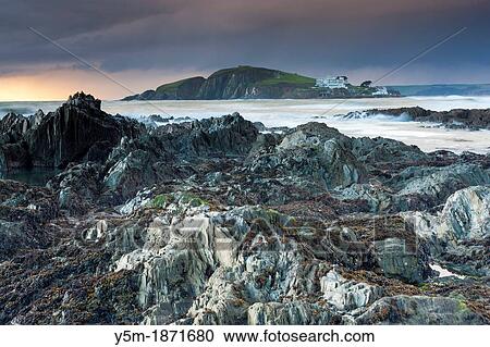 Rocky shores of Bantham at Dusk view towards Burgh Island, Devon, England, UK, Europe View Large Photo Image Stock Image - Rocky shores of Bantham at Dusk view towards Burgh Island, Devon, England, UK, Europe. Fotosearch