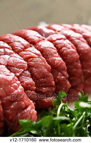 Rolled pork roast, raw with Petersilie View Large Photo Image Stock Image - Rolled pork roast, raw with Petersilie. Fotosearch
