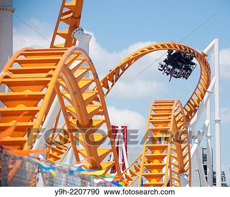 Roller coaster enthusiasts flock to Coney Island in Brooklyn in New York for the grand opening of the new Thunderbolt roller coaster.. View Large Photo Image Stock Image - Roller coaster enthusiasts flock to Coney Island in Brooklyn in New York for the grand opening of the new Thunderbolt roller coaster... Fotosearch