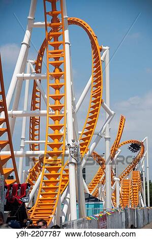 Roller coaster enthusiasts flock to Coney Island in Brooklyn in New York for the grand opening of the new Thunderbolt roller coaster.. View Large Photo Image Stock Photo - Roller coaster enthusiasts flock to Coney Island in Brooklyn in New York for the grand opening of the new Thunderbolt roller coaster... Fotosearch